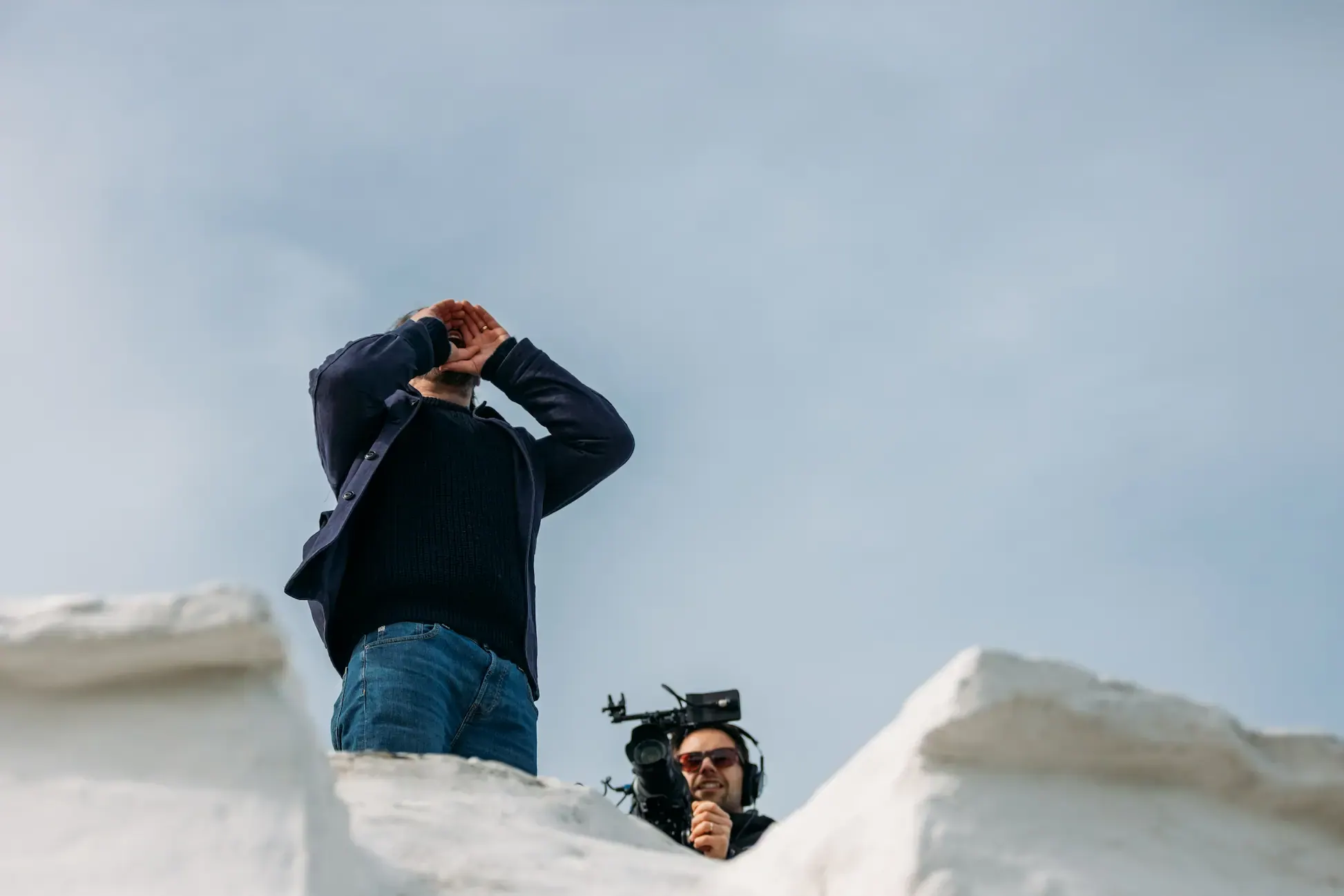 James Strawbridge recreating the Huer's Call at the Huer's Hut in Newquay, with Grant Batty filming for the Forgotten Cornwall documentary series on History Hit
