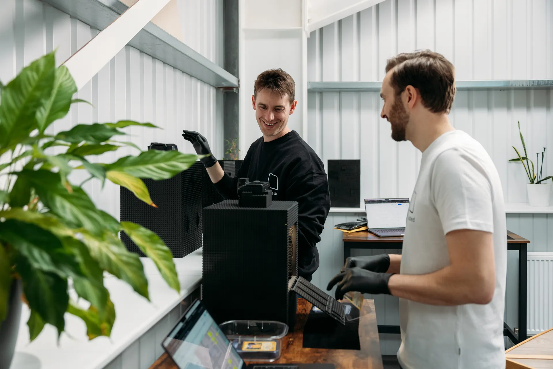 Ungraded founders Josh and John working beside their 3D trading card imaging equipment during the launch campaign